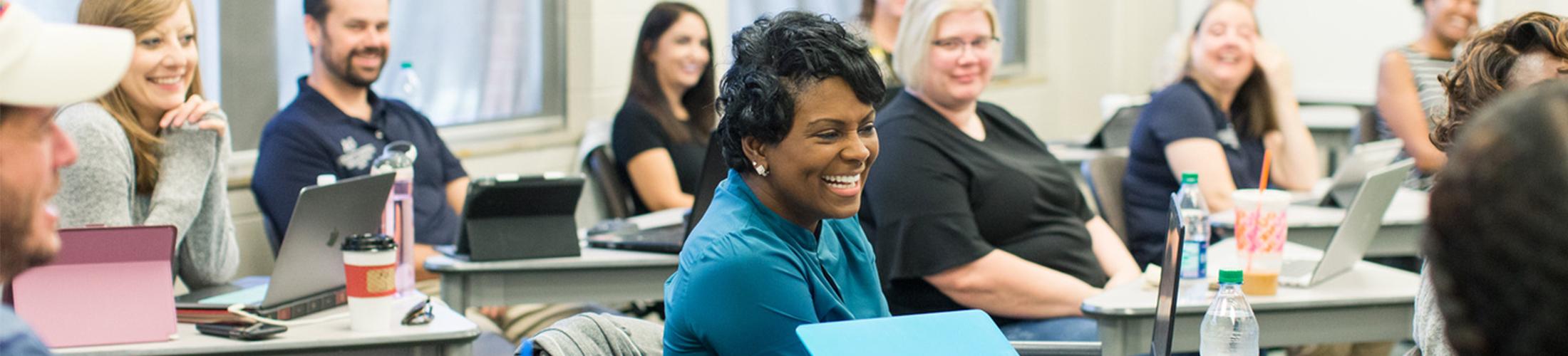 PhD female student smiling in class